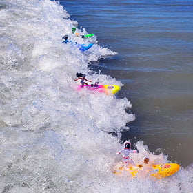 Surfer Dudes beach toy on sand for outdoor playtime.