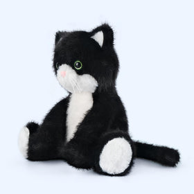SuzziPals decorative tuxedo cat plush brightening a bedroom