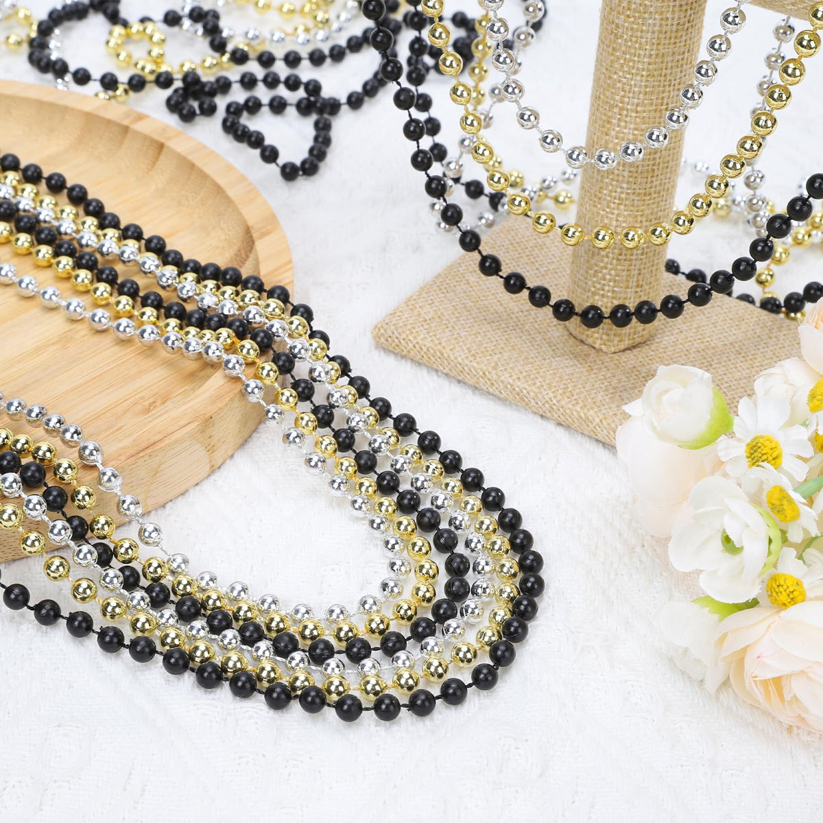 Swanucky Mardi Gras beads in silver capture light for vibrant party accents.