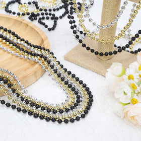 Swanucky Mardi Gras beads in silver capture light for vibrant party accents.