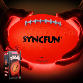 SYNCFUN Glow football on a night field glowing with vibrant LEDs for night play.