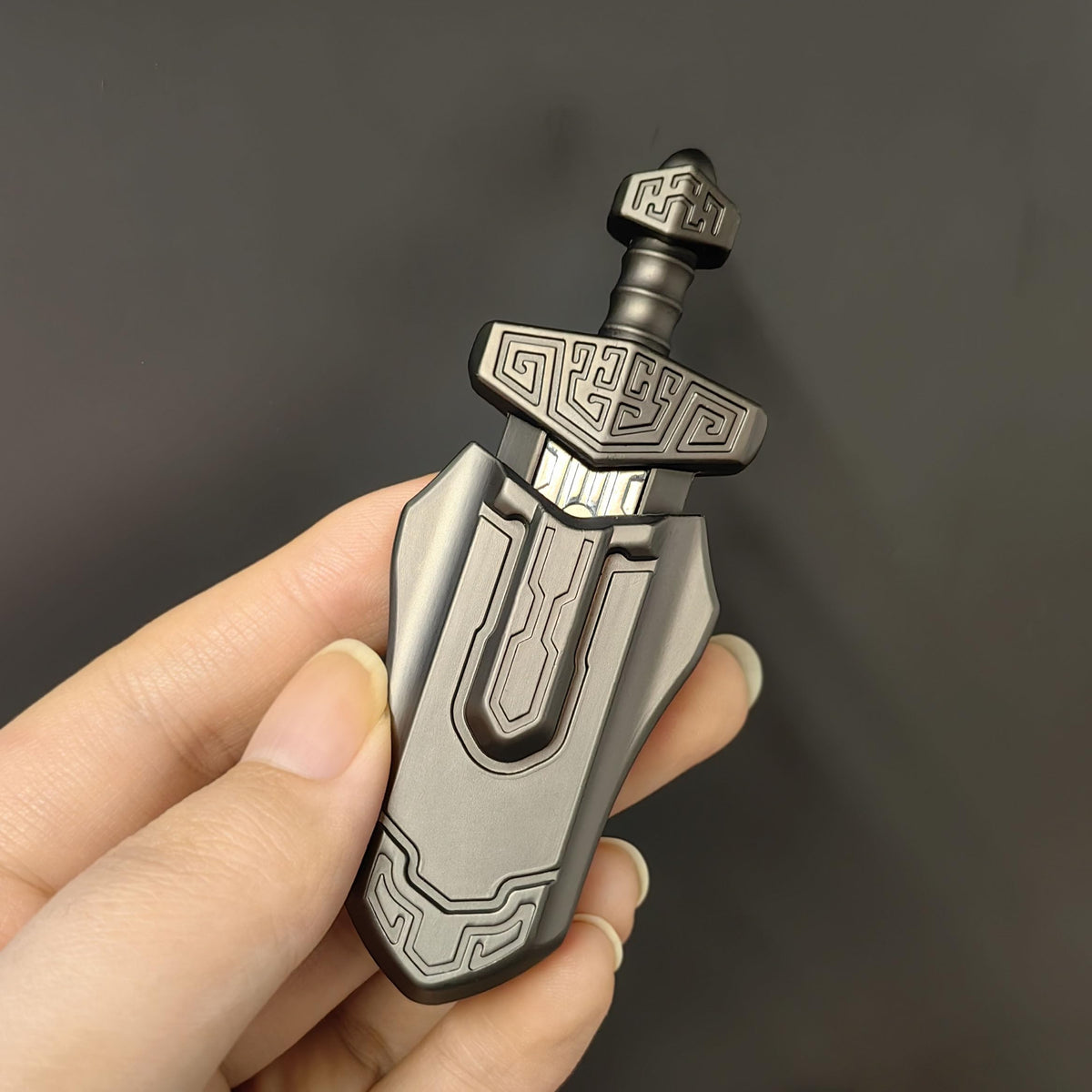 T-Conceal EDC Sword grey in-hand use demonstrates discreet desk-friendly action.