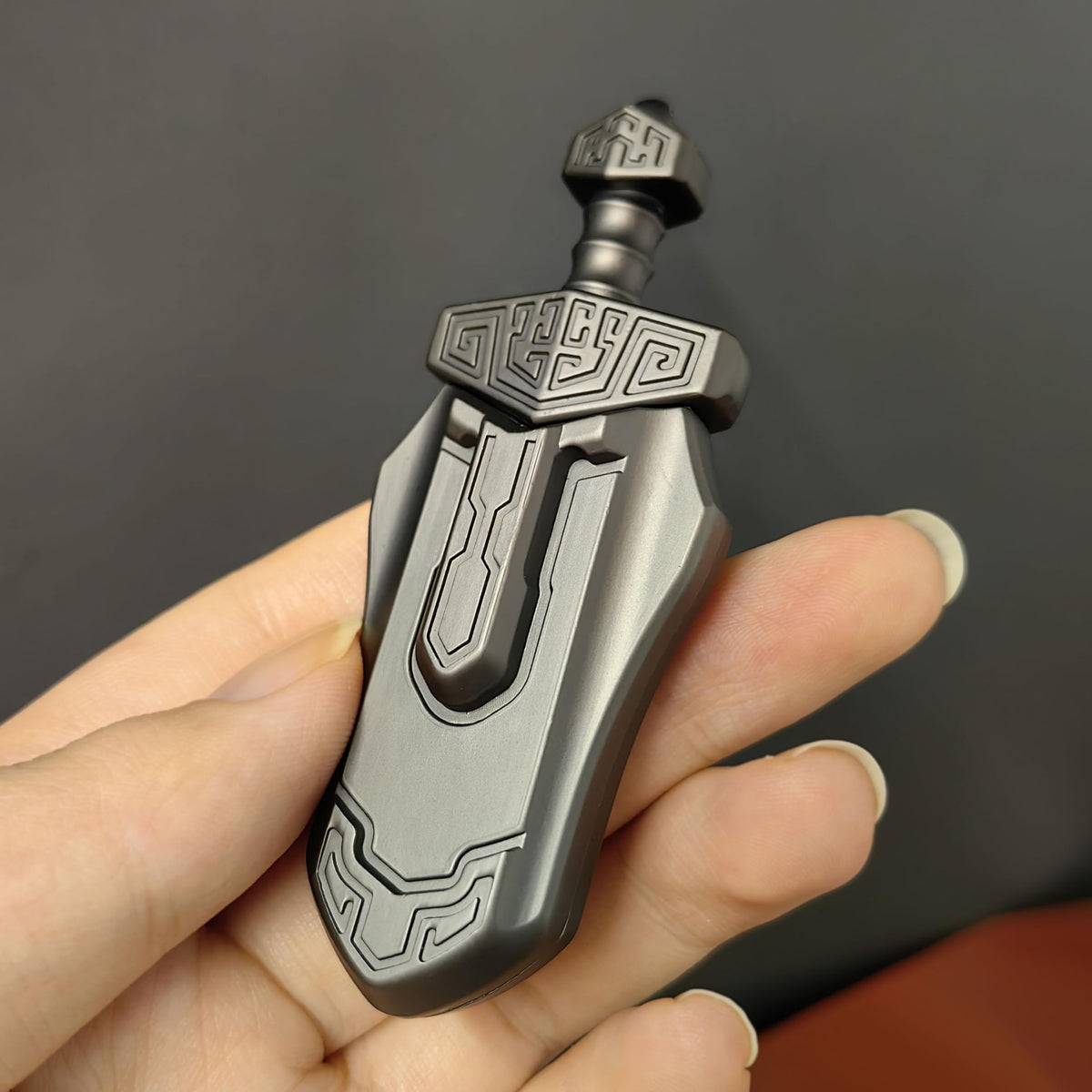 T-Conceal EDC Sword grey magnet close-up shows metal construction.