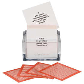 TableTopics clear cube container showing the compact starter card set
