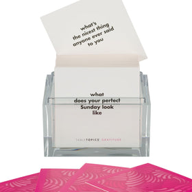 TableTopics Gratitude cards in a clear cube container for easy access.