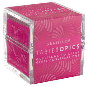 TableTopics Gratitude cards on a dinner table sparking connection.