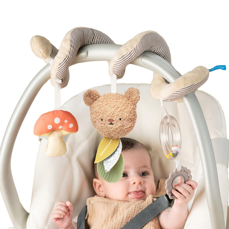Taf Toys Bear Hug Spiral car seat toy with plush bear for on-the-go entertainment.