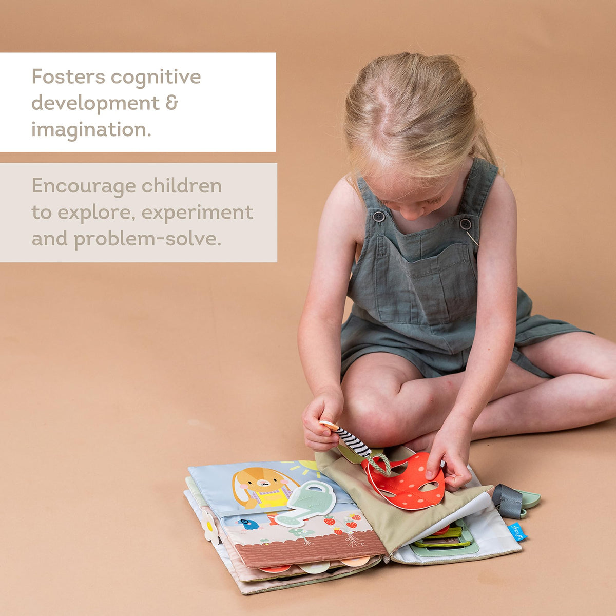 Taf Toys Busy Book soft fabric pages are durable for enthusiastic toddlers