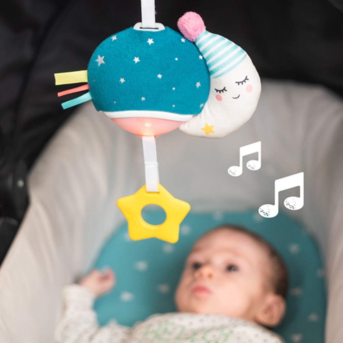 Taf Toys Musical Mini Moon pull-down star triggers music and color-changing lights.