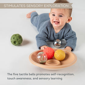 Taf Toys soft design supports curious exploration during tummy time.