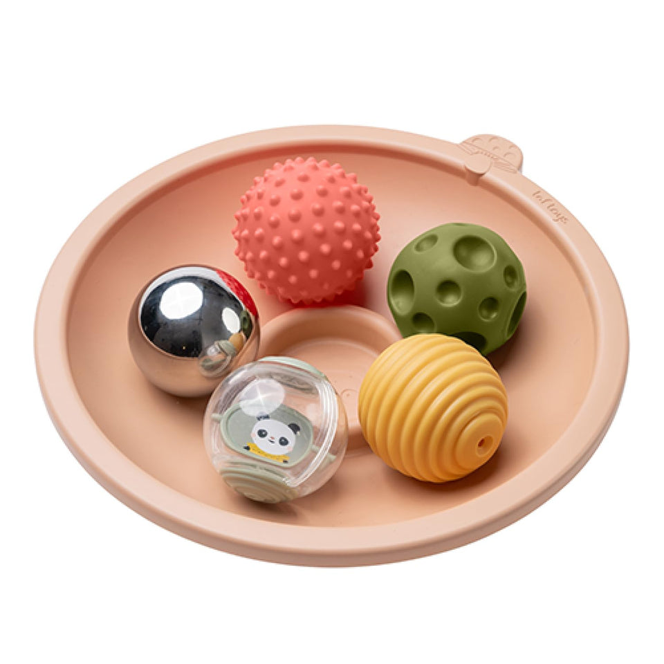 Taf Toys tummy time play tray seen from the side with a gentle sway encouraging exploration.