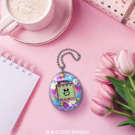 Tamagotchi Original pink-frame purple-buttons for bright handheld play.