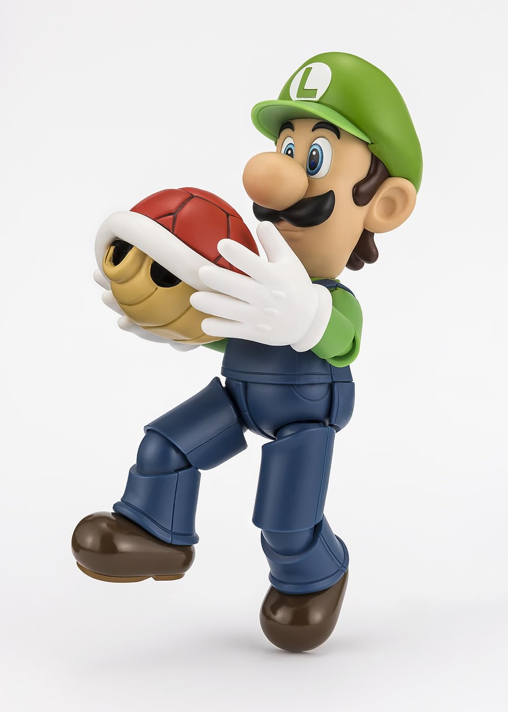Tamashii Nations Luigi S.H.Figuarts brick block included for interactive display.