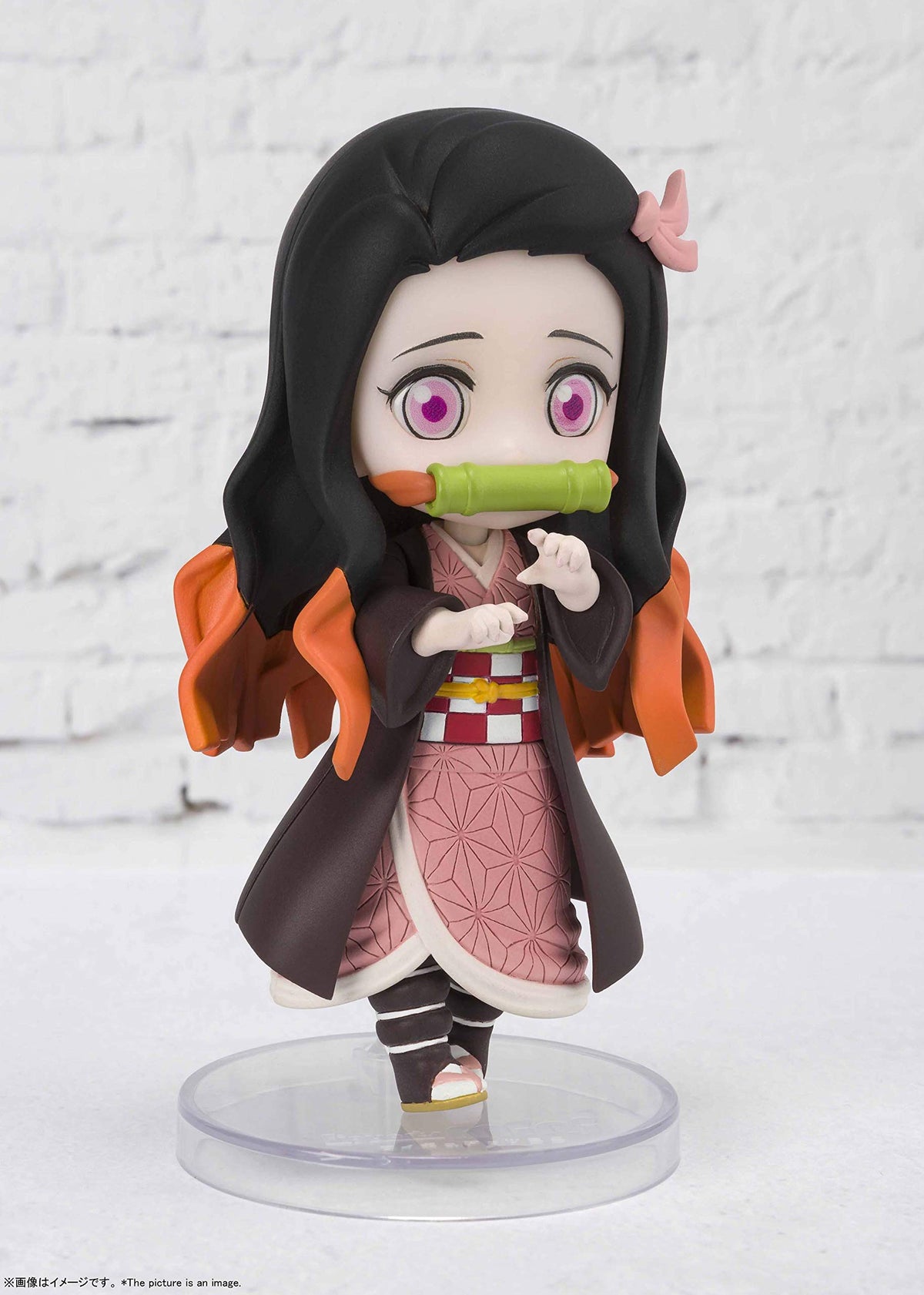 Close-up of detailed eyes on Nezuko for collectors.