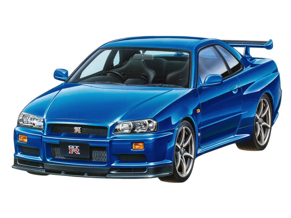 Tamiya Nissan Skyline GT-R V-Spec R34 front view reveals white finish and iconic silhouette.