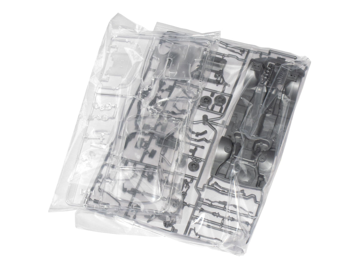 Tamiya Nissan Skyline GT-R V-Spec R34 packaging image demonstrates authentic product presentation.