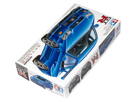 Tamiya Nissan Skyline GT-R V-Spec R34 side view showing precise panel lines for accurate display.
