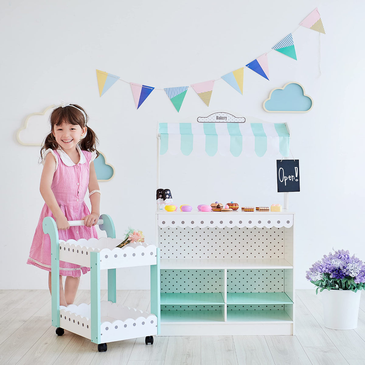 Eighteen pretend desserts include macarons and petit fours for realistic play.