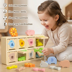 Teekdeer wooden keys and boxes demonstrate discovery and fine motor practice through unlocking play.