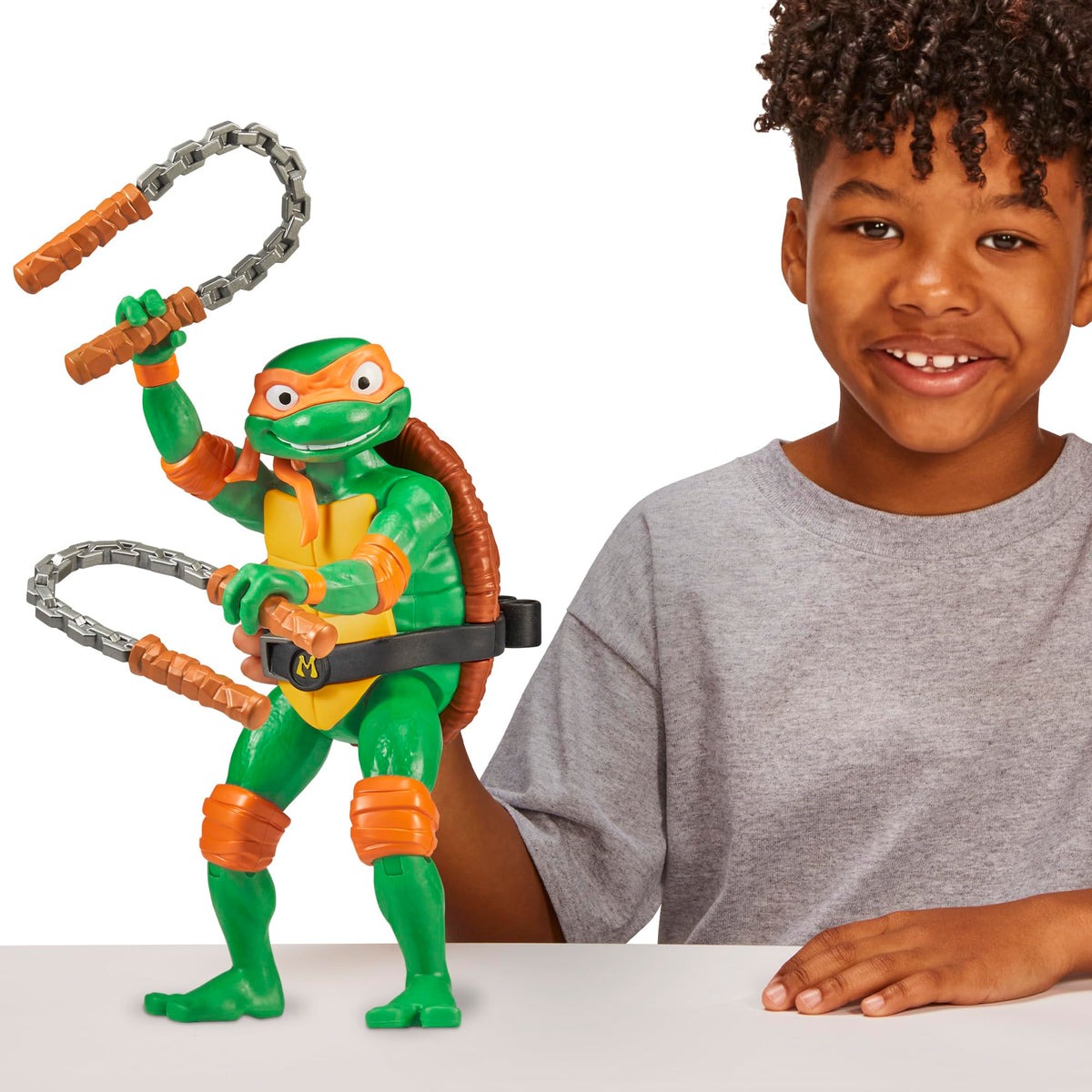 Teenage Mutant Ninja Turtles Michelangelo movie packaging—eye-catching display-friendly packaging.