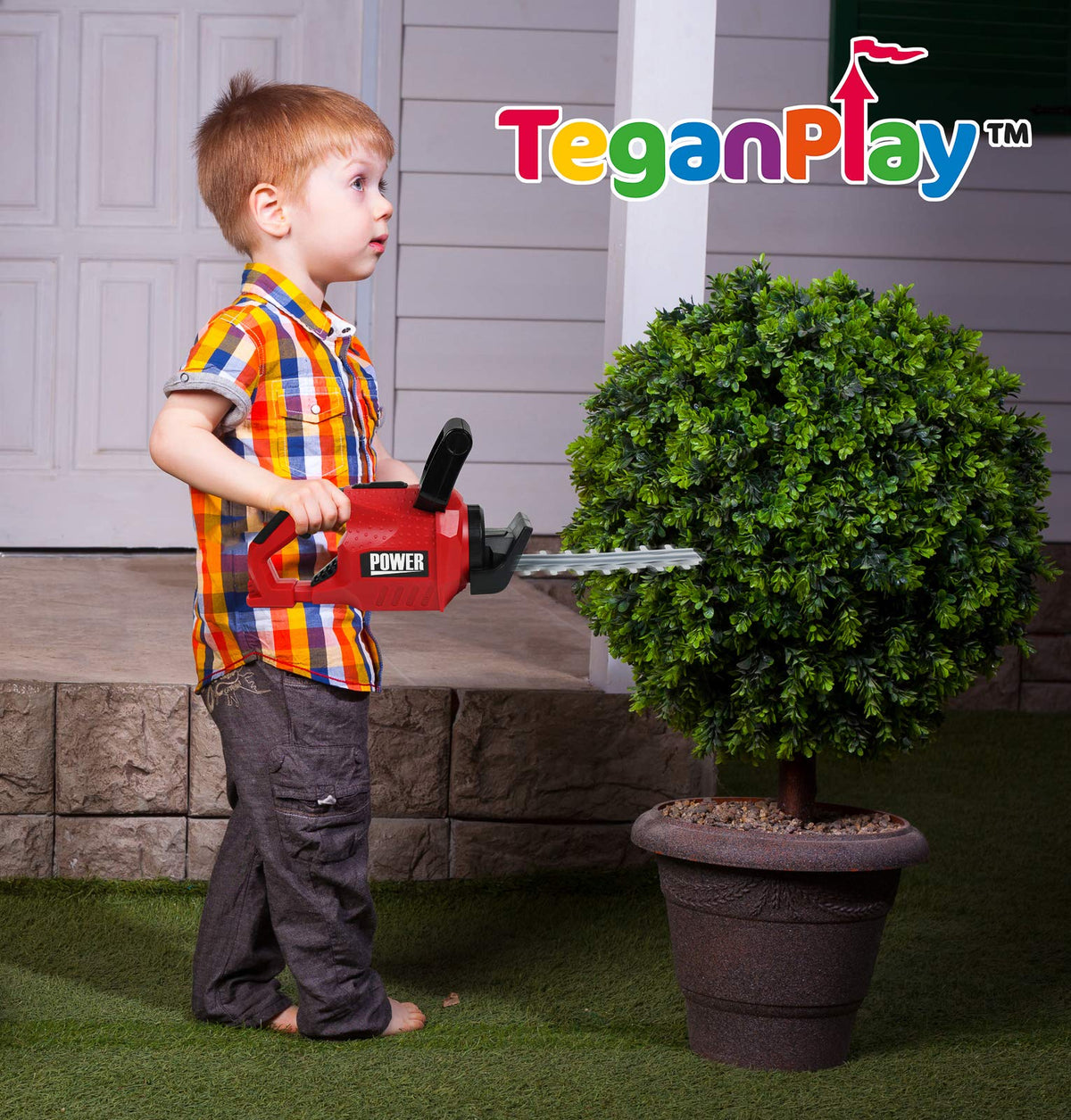 TeganPlay safety goggles for kids during pretend gardening.