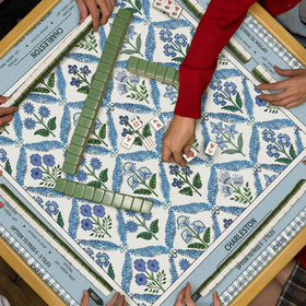 Tegeme Chinoiserie mat doubles as decorative cover for dining and games