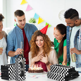 Tellegloww table display setup draws attention to treats and party favors.
