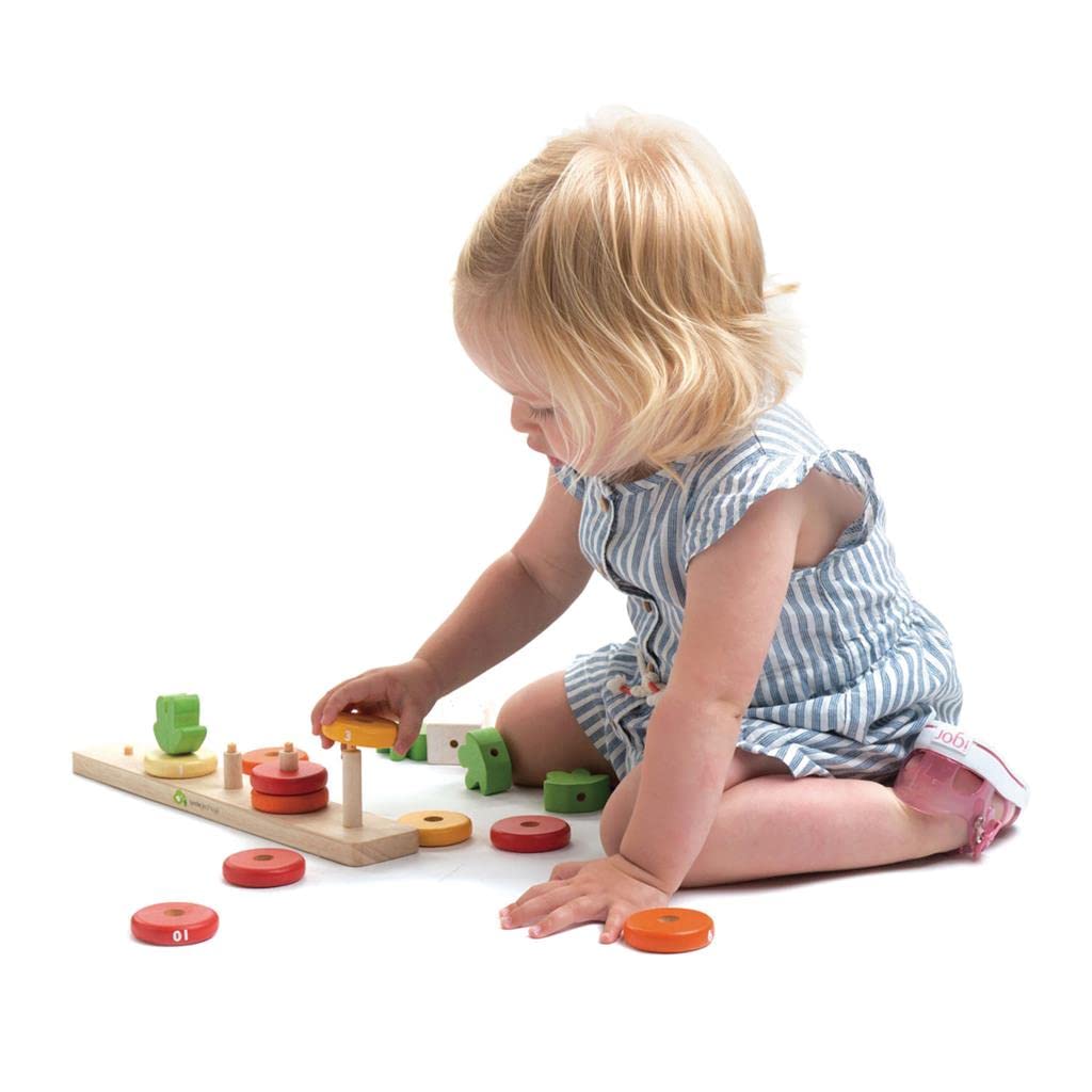 Tender Leaf Toys Counting Carrots rings arranged in order demonstrate color sorting and sequencing.
