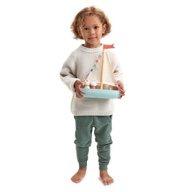 Tender Leaf Sailaway Boat with figures ready for pretend voyages.