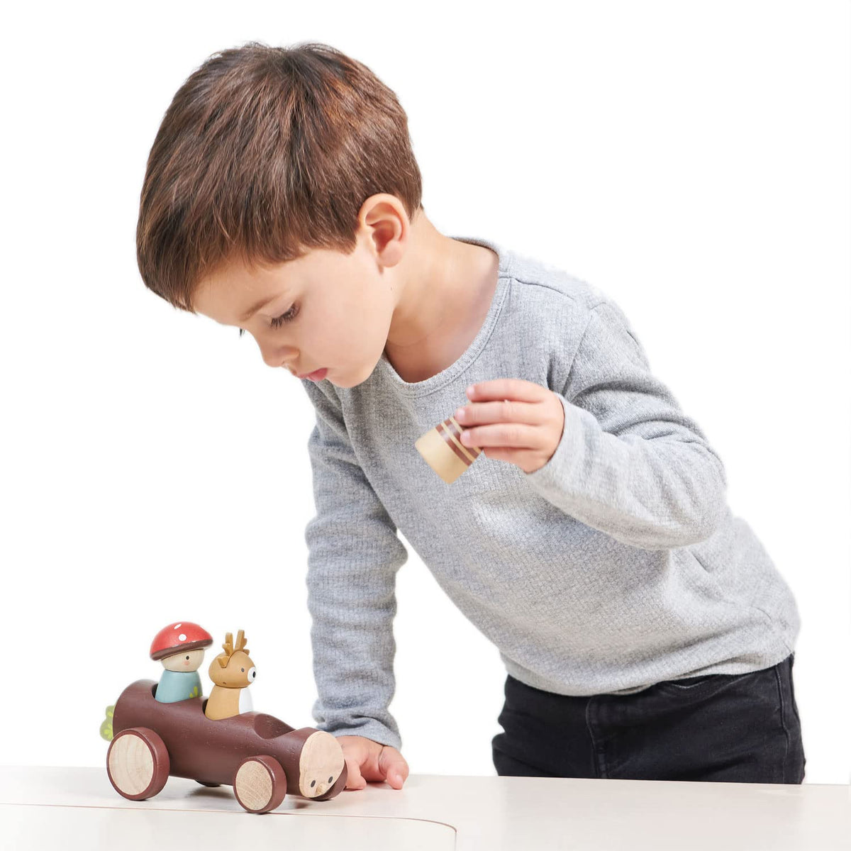 Tender Leaf Toys Timber Taxi wheels close-up showing rolling action for active play