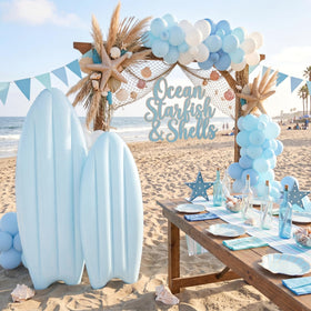 Teyva Daily inflated blue surfboard decor for beach party setups.