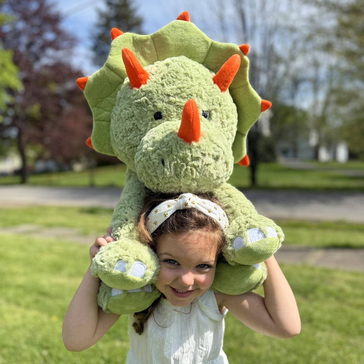 Tezituor green dinosaur plush pillow provides comfy support.