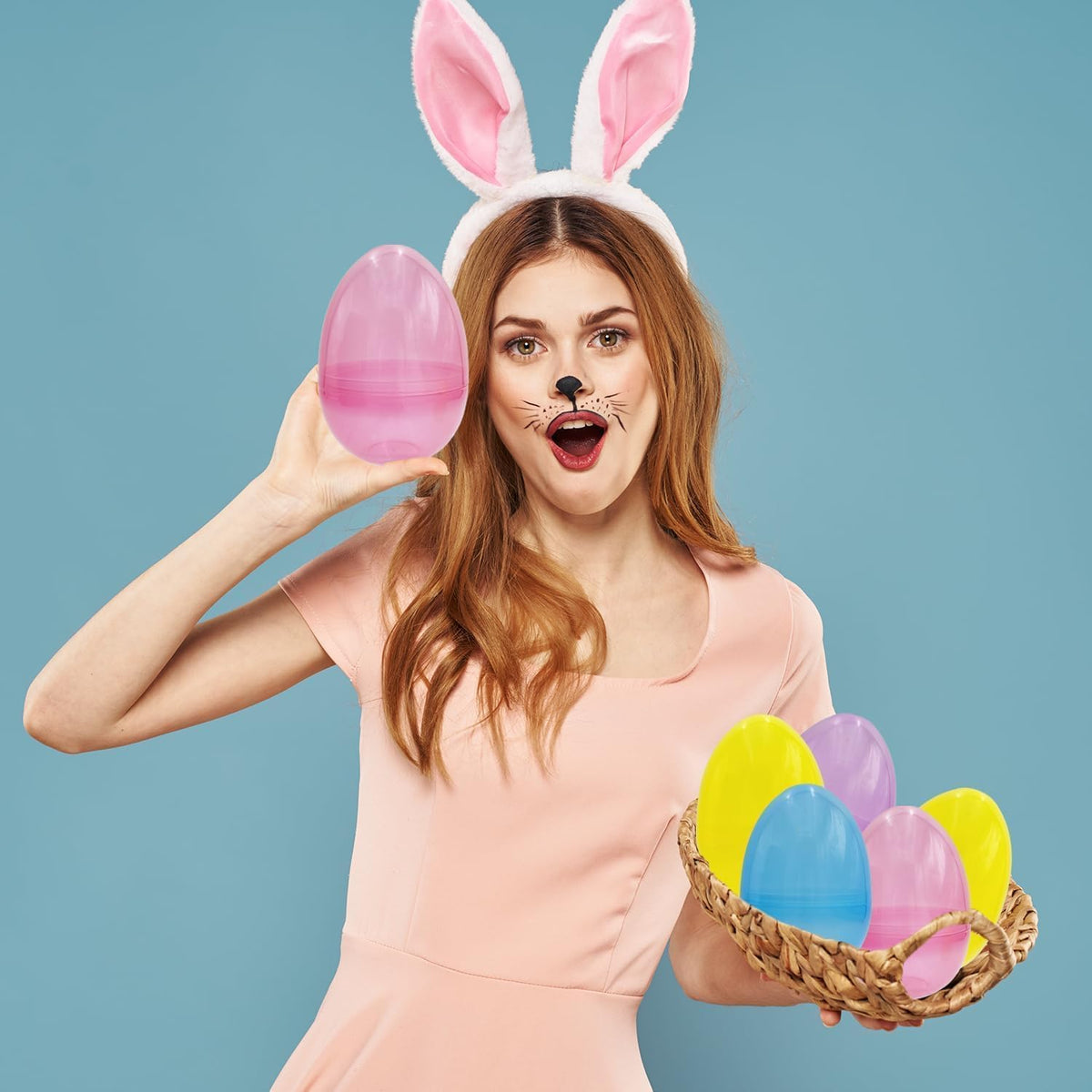 The Dreidel Company yellow 6-inch fillable Easter egg stands upright for display