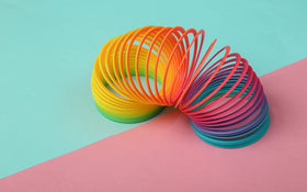 The Dreidel Company classroom reward coil-spring toy enhances small-group activities.