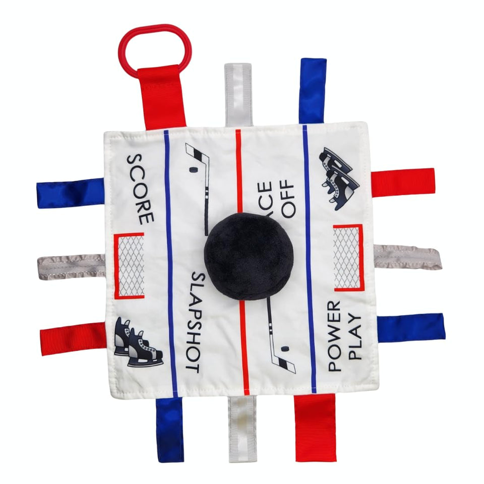 The Learning Lovey hockey puck ice rink slapshot lovey tag toy promotes sensory play on the go.