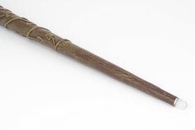The Noble Collection Hermione Granger Illuminating Wand tray key for secure battery cap.