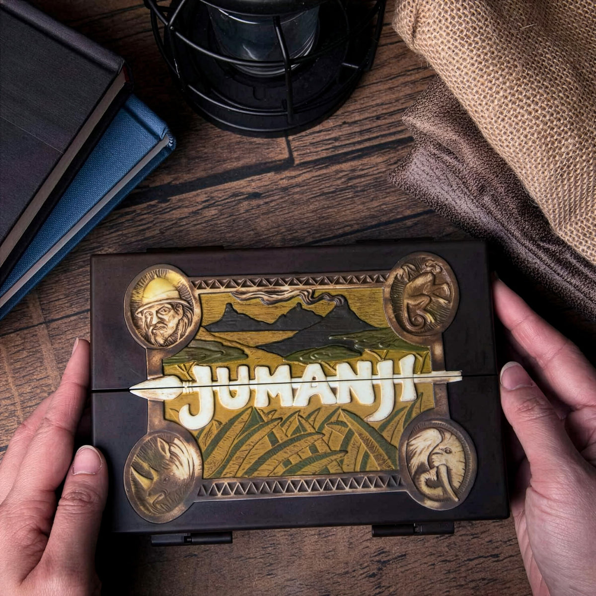 The Noble Collection Jumanji miniature board open-view shows inner mechanics for display.