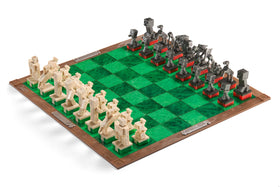 The Noble Collection Minecraft Chess Set board top view shows grass texture and metallic logos
