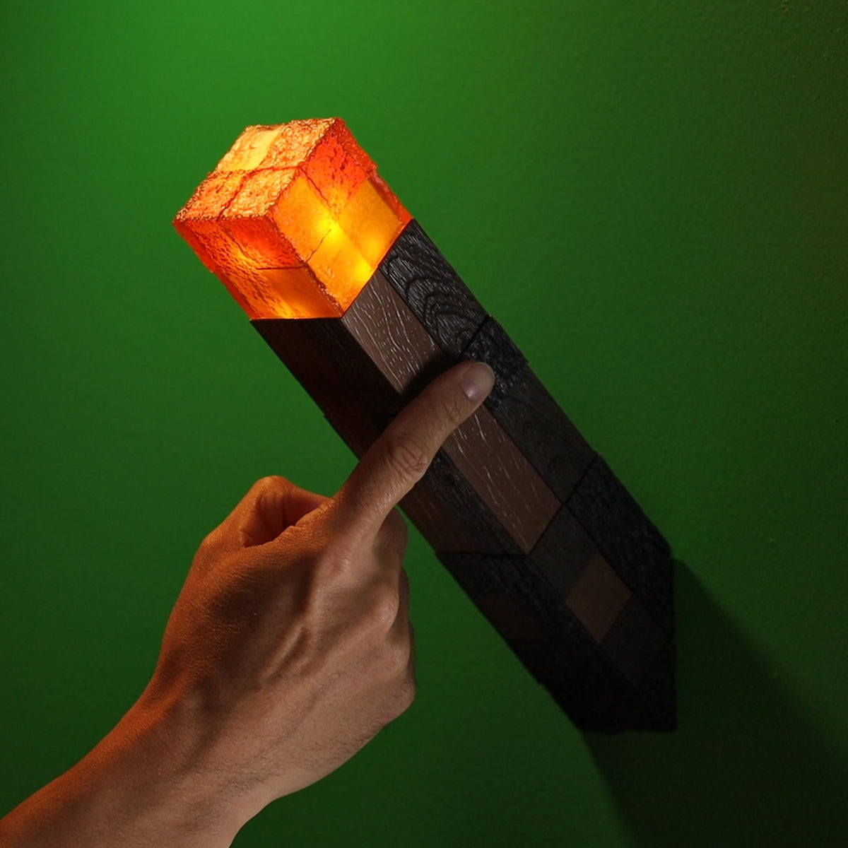 The Noble Collection Minecraft Torch compact 10-inch height fits on shelves.