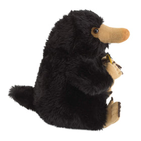 The Noble Collection Niffler Plush displayed with other collectibles idea.
