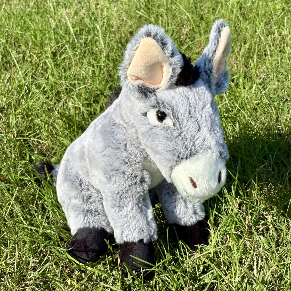 The Petting Zoo donkey plush fur texture showing soft gray fur with pink accents.