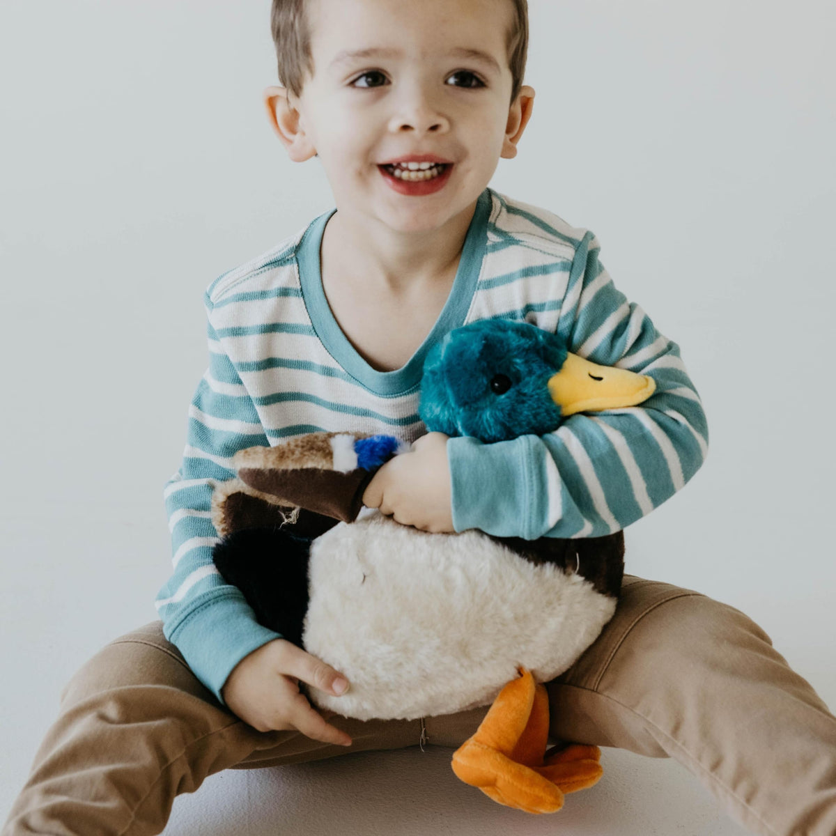 The Petting Zoo duck plushie orange feet add playful color.