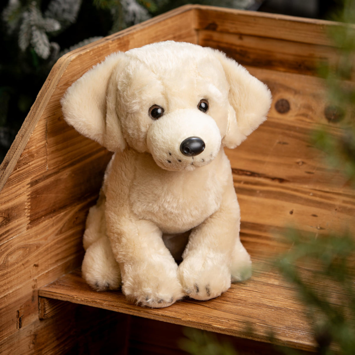 The Petting Zoo yellow lab plush ears and coat invite touch and comfort.