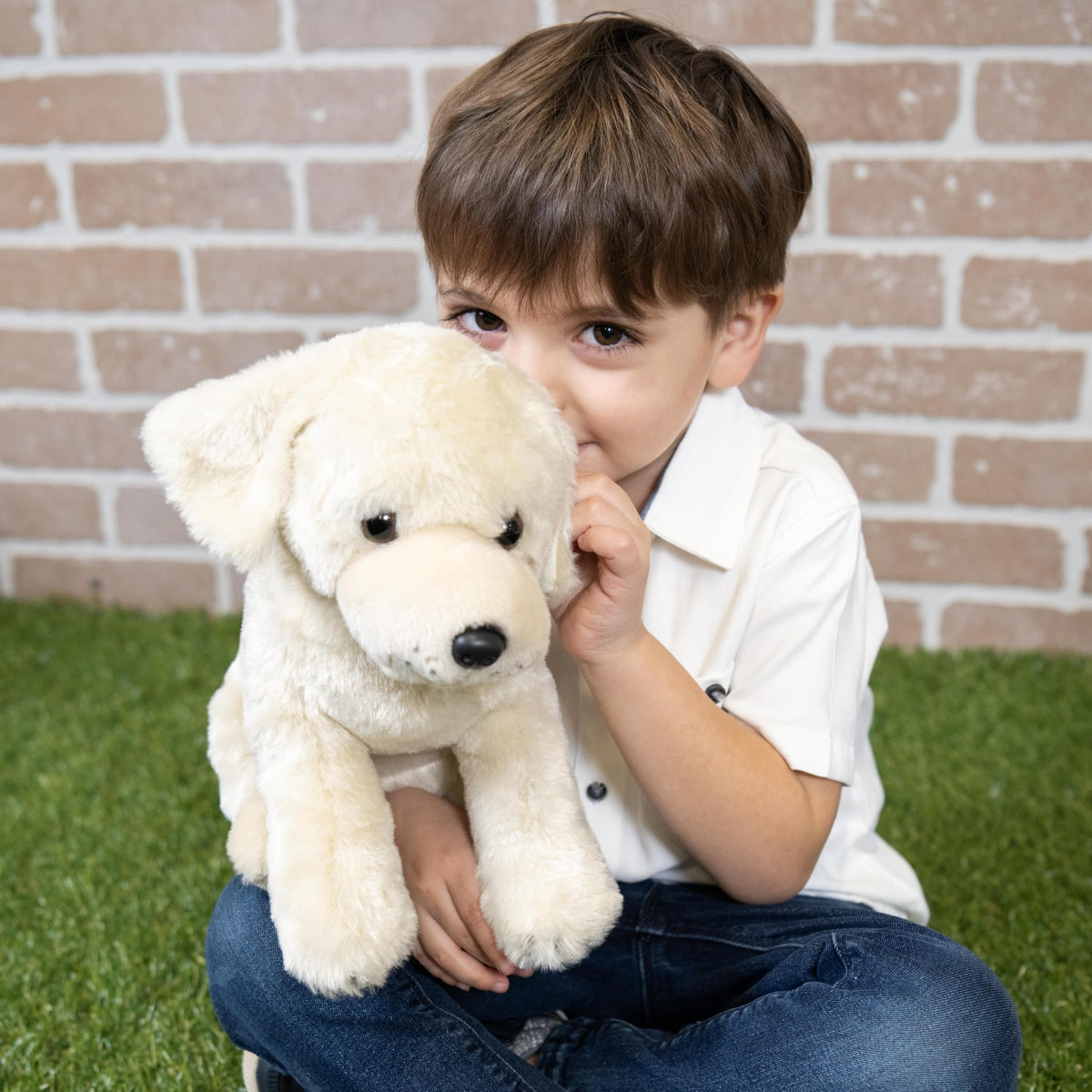 The Petting Zoo sitting plush dog shows durable stitching for everyday adventures.