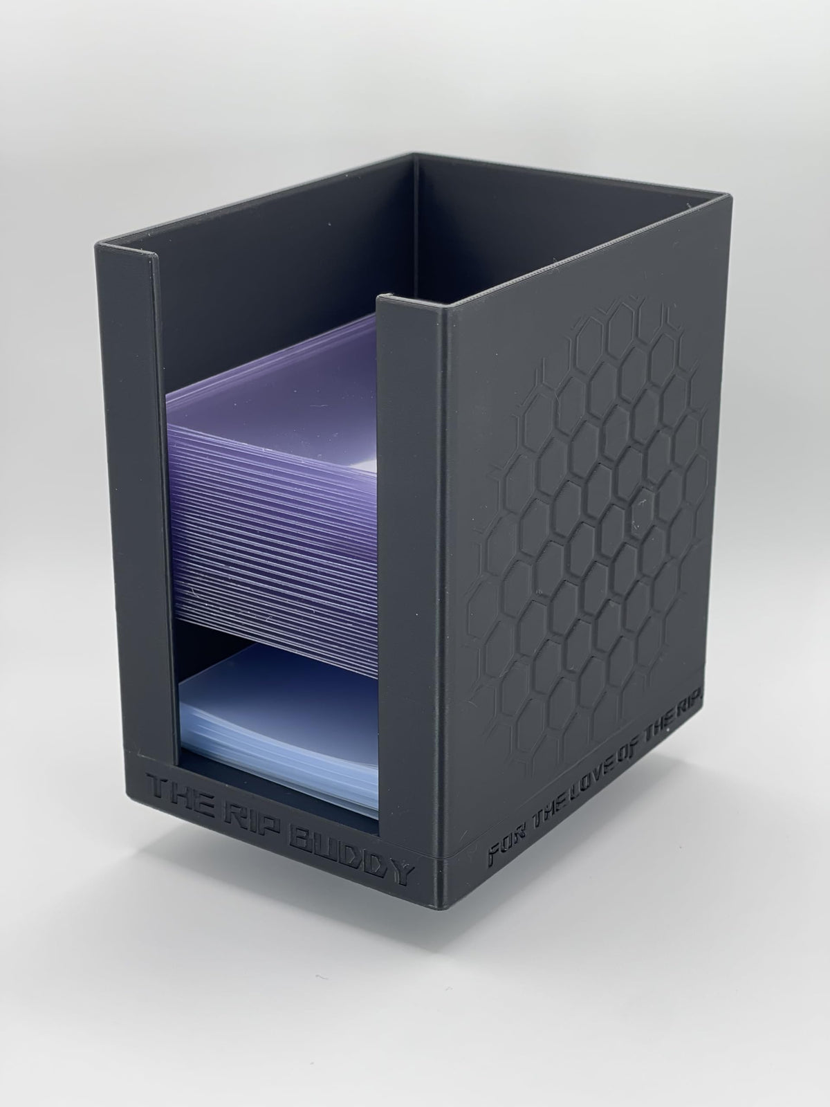 The Rip Buddy dual-compartment organization keeps sleeves and top loaders ready during breaks