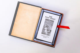 The Unemployed Philosophers Guild Pulp Tarot card detail captures dynamic artist renderings.
