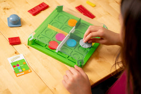 ThinkFun Invasion of the Cow Snatchers magnetic tokens image with UFO, cows and bull for problem solving.