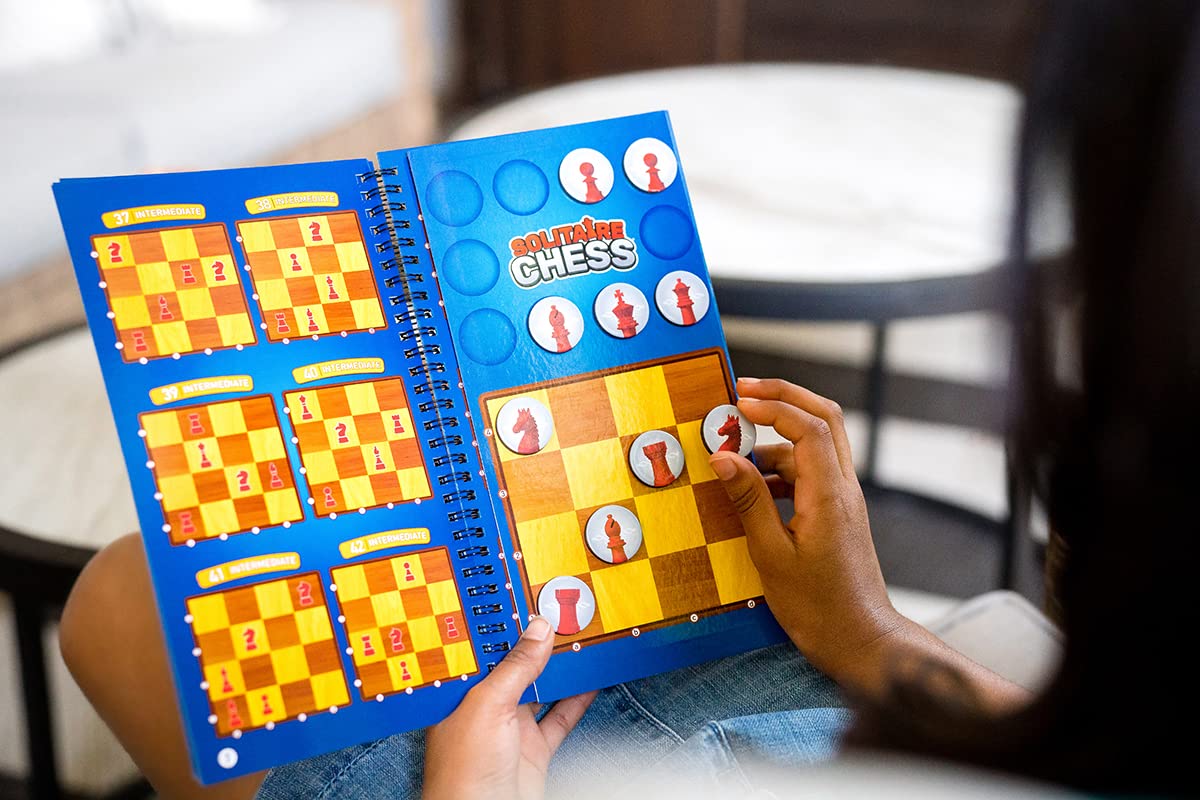 ThinkFun Solitaire Chess Magnetic Travel Puzzle held in hand for portable play.