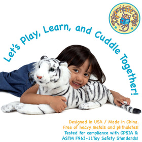 TigerHart Saphed plush in a child’s arms, suggesting a gentle bedtime companion.