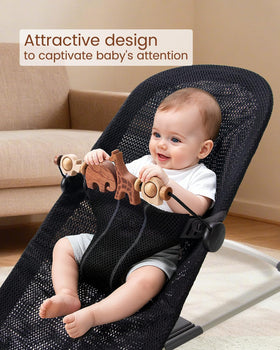 TinlyFinly wooden colorful animals rotate to captivate baby during playtime.